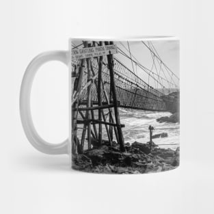 Rope foot bridge from plateau to rock island B&W Mug